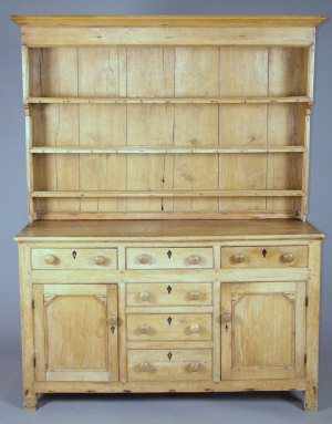 Appraisal: A pine dresser late th century the moulded cornice above