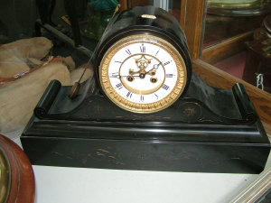 Appraisal: A late th century Continental slate cased mantel clock the