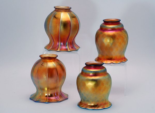 Appraisal: Two pairs of gold iridescent Steuben art glass lamp shades