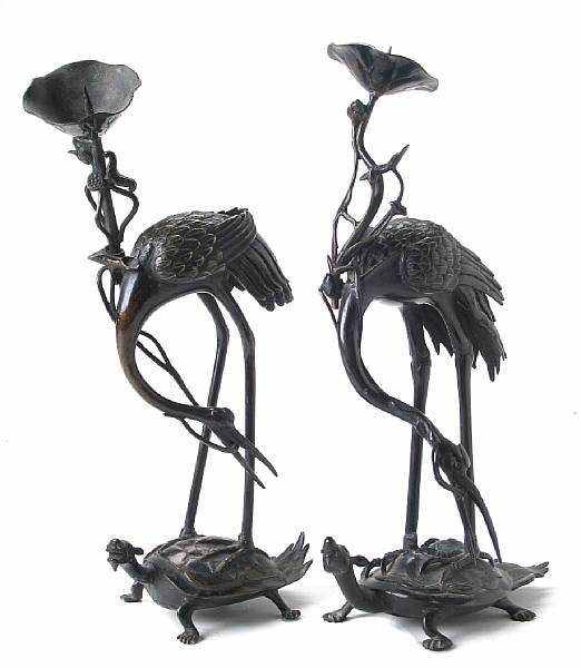 Appraisal: A pair of Japanese bronze crane and tortoise candle prickets