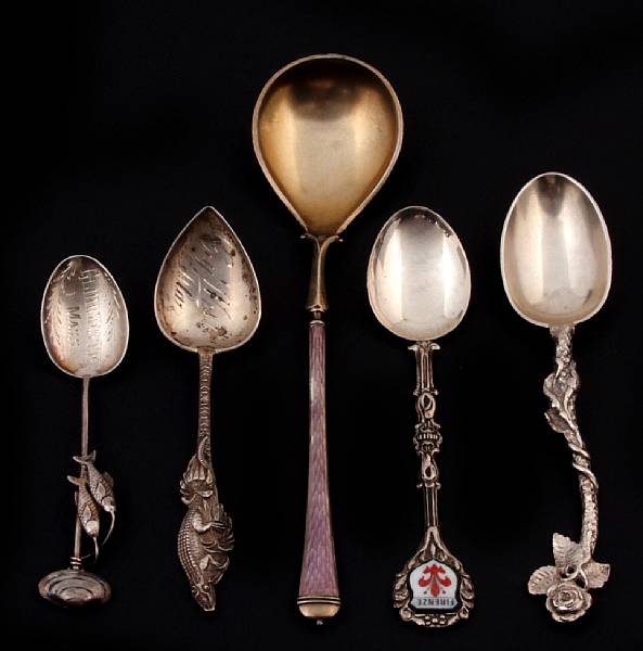 Appraisal: A group of silver flatware Comprising sterling souvenir spoons in