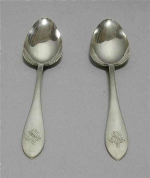 Appraisal: PAIR OF ELEGANT SILVER DESSERT SPOONS Marked Sterling pseudo-hallmarks and