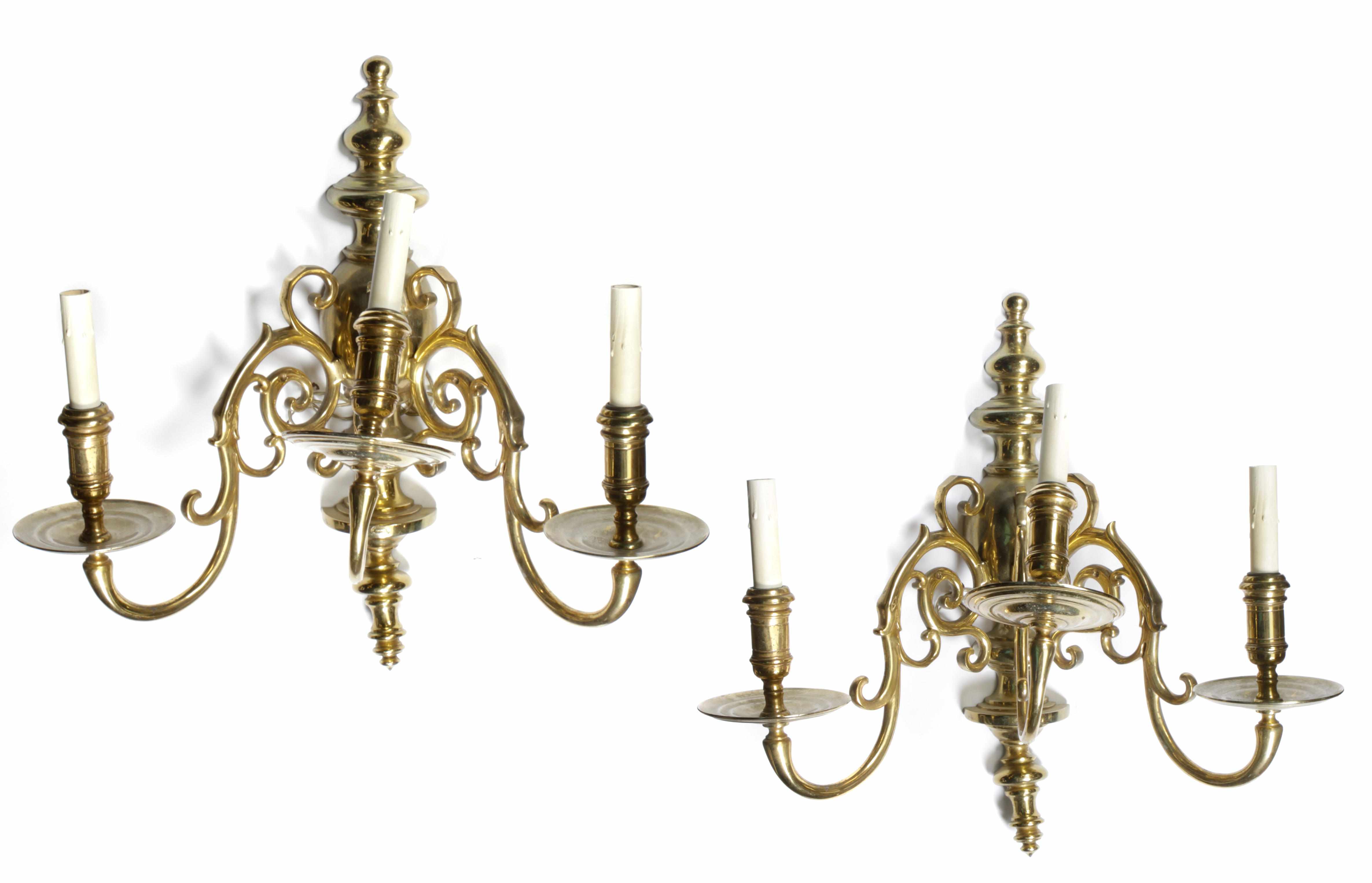 Appraisal: A pair of Dutch Baroque style brass three light candelabra