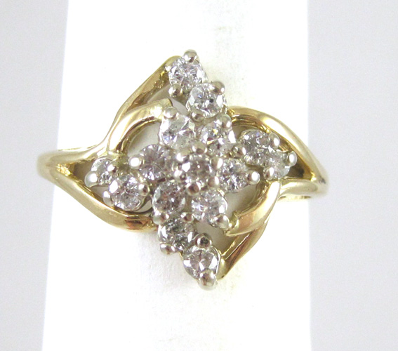 Appraisal: DIAMOND CLUSTER AND FOURTEEN KARAT GOLD RING set with round