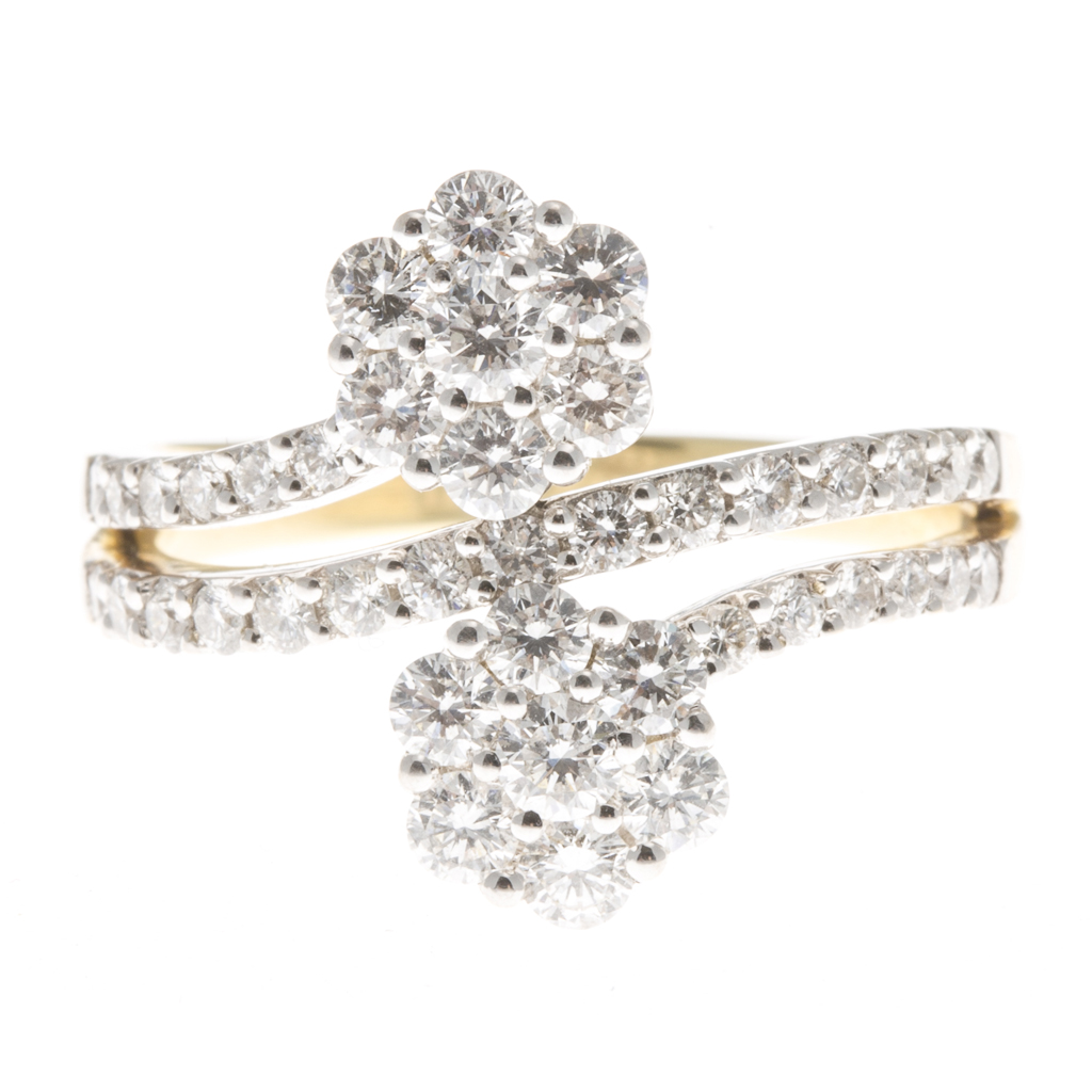 Appraisal: A modern diamond set cluster ring composed of two clusters