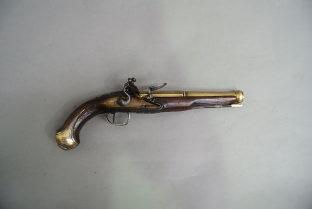 Appraisal: A French brass barrel flintlock single shot pistol caliber inch