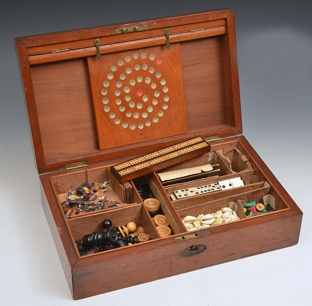 Appraisal: A TH CENTURY MAHOGANY GAMES COMPENDIUM containing a harlequin set