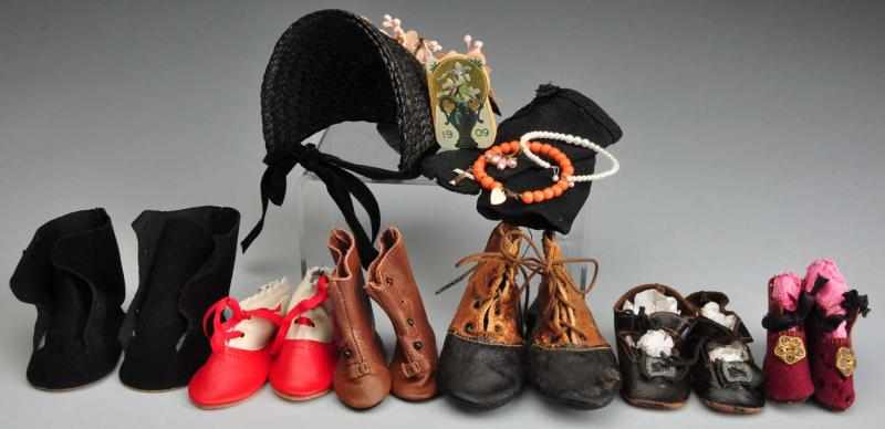 Appraisal: Lot of Doll Shoes Accessories Description Antique black leather doll