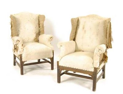 Appraisal: A pair of mahogany wing armchairs in George III style