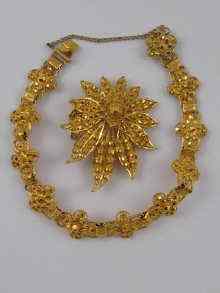 Appraisal: A yellow metal tests high carat gold bracelet and brooch