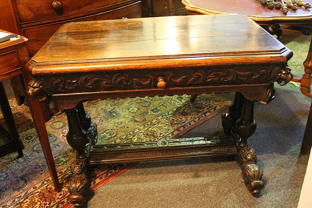 Appraisal: A VICTORIAN CARVED OAK HALL TABLE fitted one long drawer