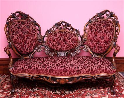 Appraisal: ROCOCO REVIVAL PART-EBONIZED AND CARVED WALNUT SOFA The three oval