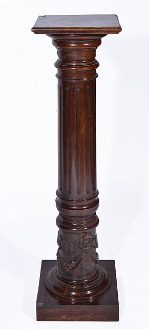 Appraisal: A VICTORIAN MAHOGANY COLUMN with fluted and carved decoration on