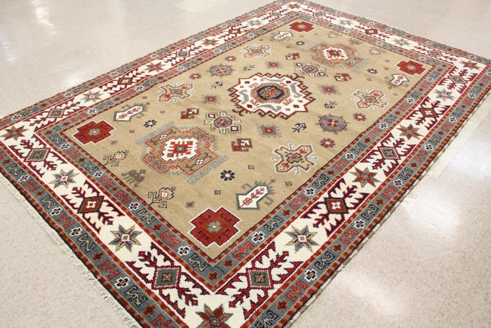 Appraisal: HAND KNOTTED ORIENTAL CARPET Persian tribal design on beige ground