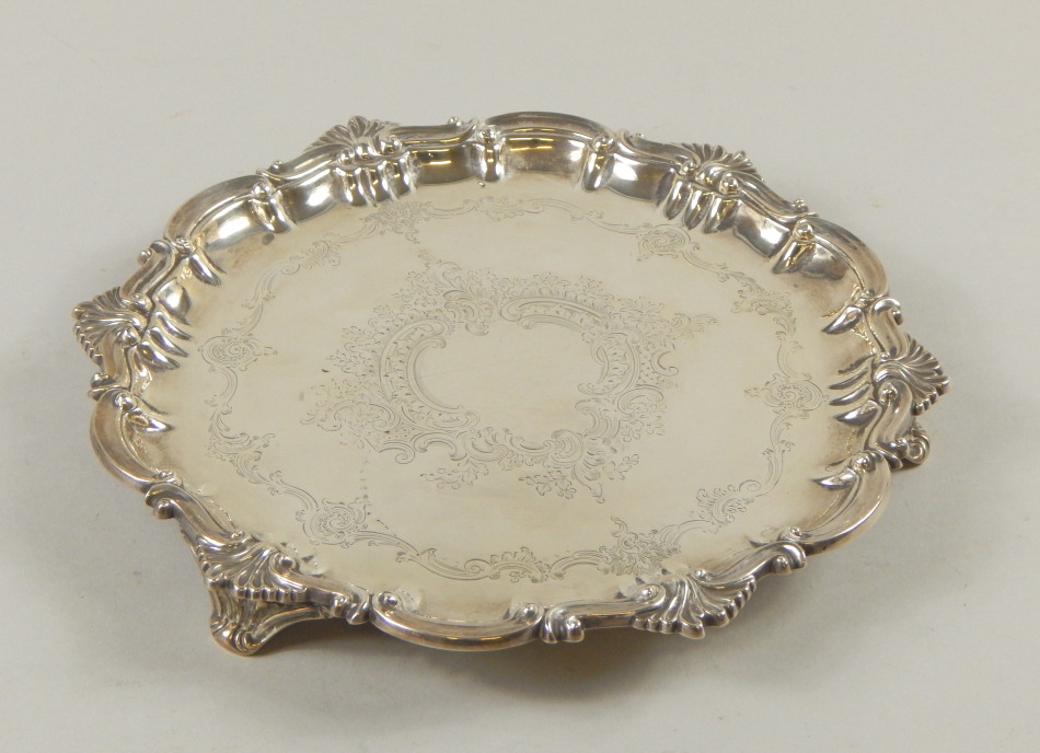 Appraisal: An Edwardian silver salver the shaped edge cast with scrolls