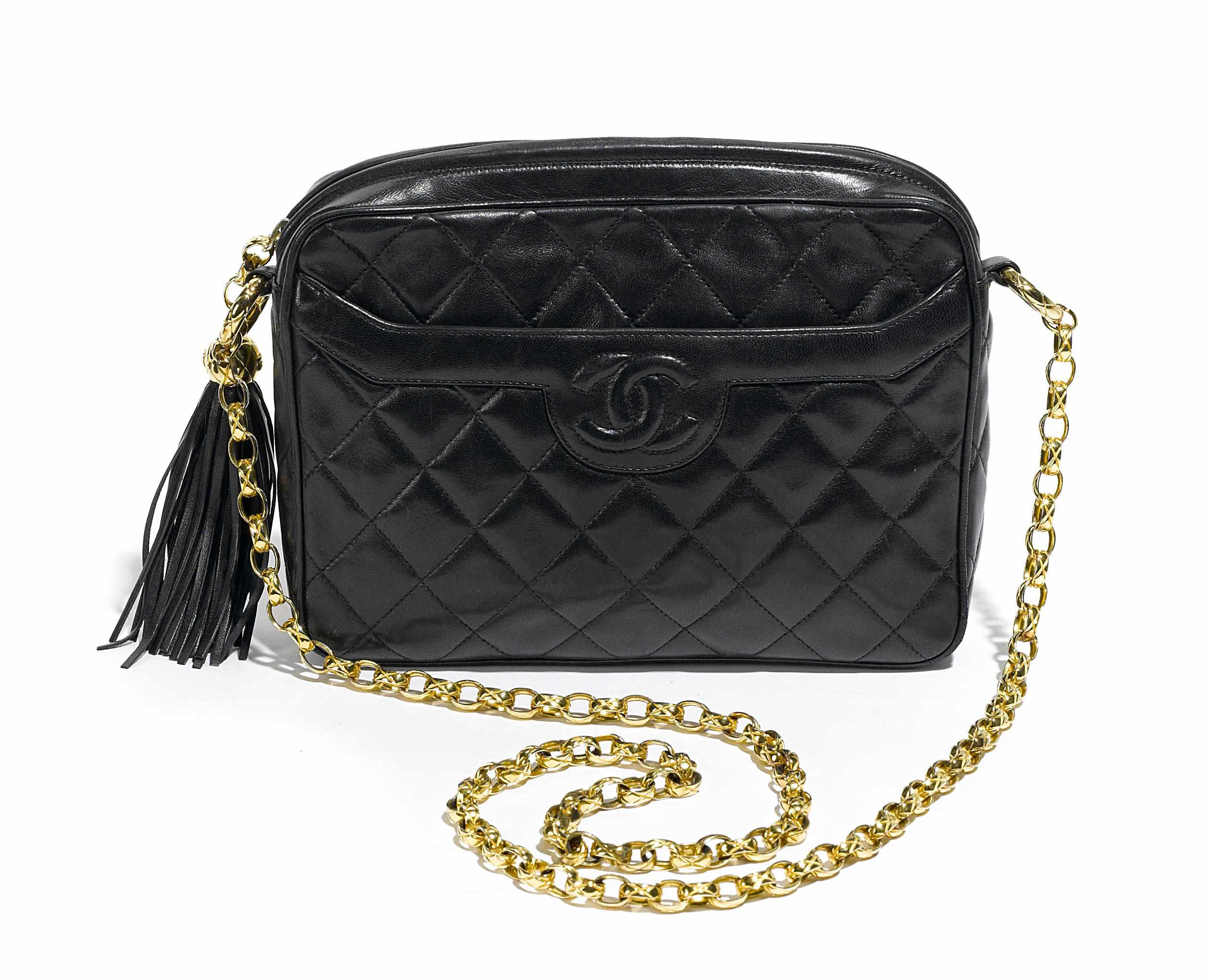 Appraisal: A Chanel black shoulder bag chain shoulder handle and tassled