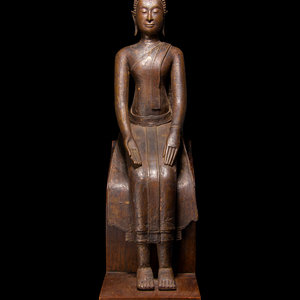 Appraisal: A Thai Bronze Figure of Seated Buddha the slender figure