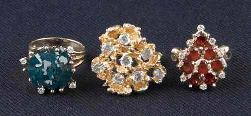 Appraisal: Three cluster K yellow gold rings to include emerald crystal