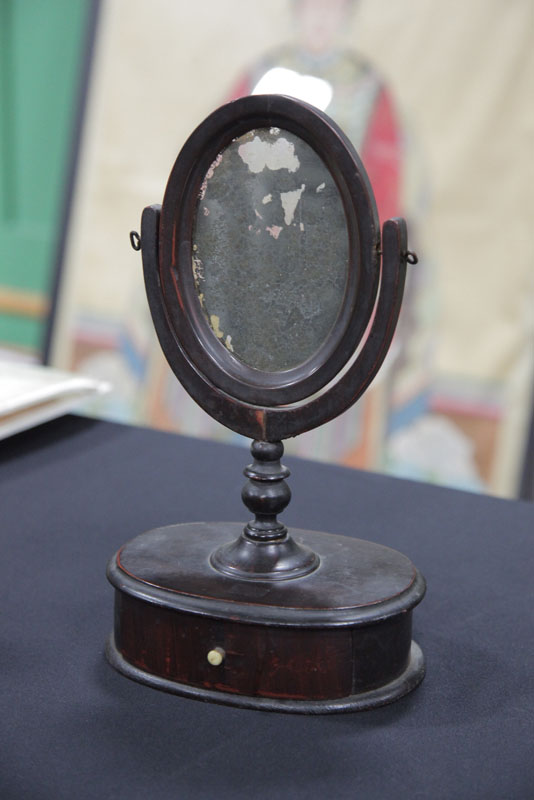 Appraisal: MINIATURE DRESSING MIRROR Early grain decorated and oval mirror on