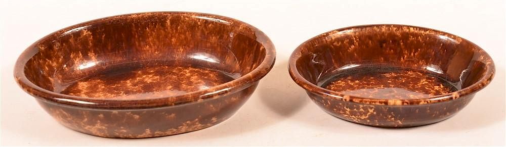 Appraisal: Two Rockingham Glazed Yellowware Oval Bowls Two Rockingham Glazed Yellowware