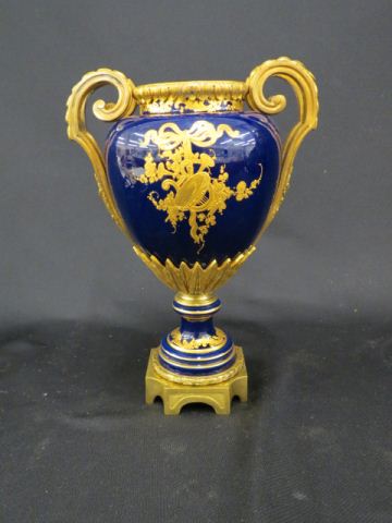 Appraisal: Sevres Porcelain Urn gold decoration on cobalt bronze mounts handled