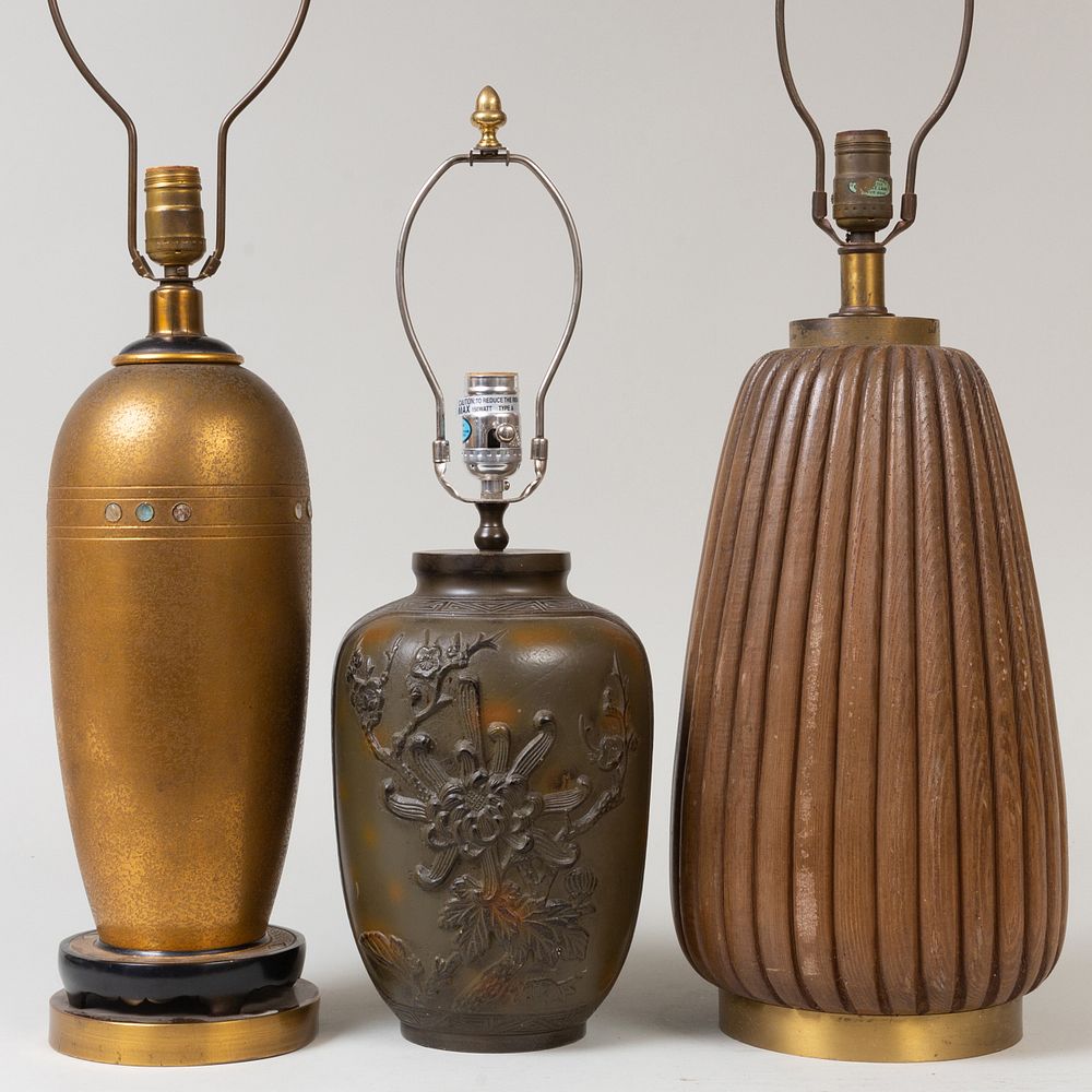 Appraisal: Three Modern Lamps Comprising A cast metal lamp decorated in