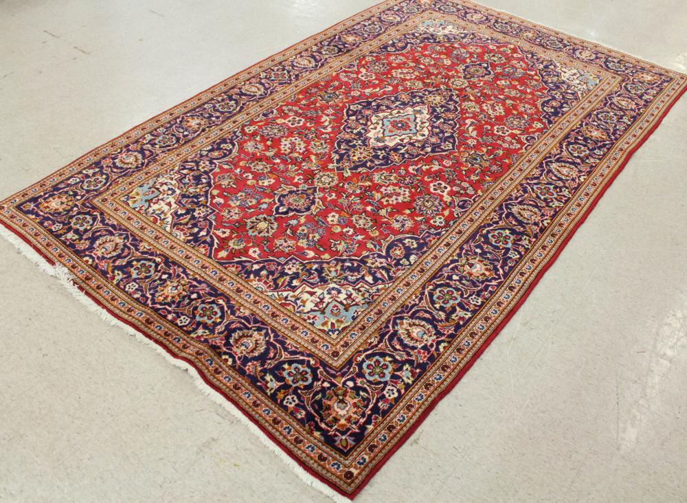 Appraisal: HAND KNOTTED PERSIAN CARPET floral and central floral medallion design