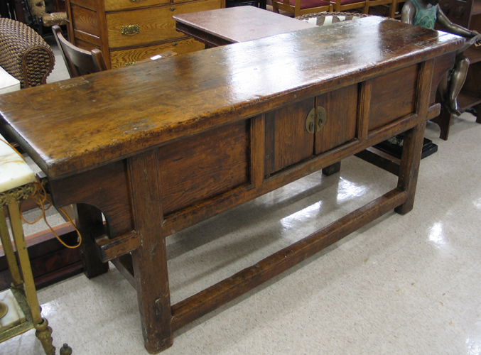 Appraisal: A LONG ELMWOOD ALTAR TABLE Chinese th century elements having