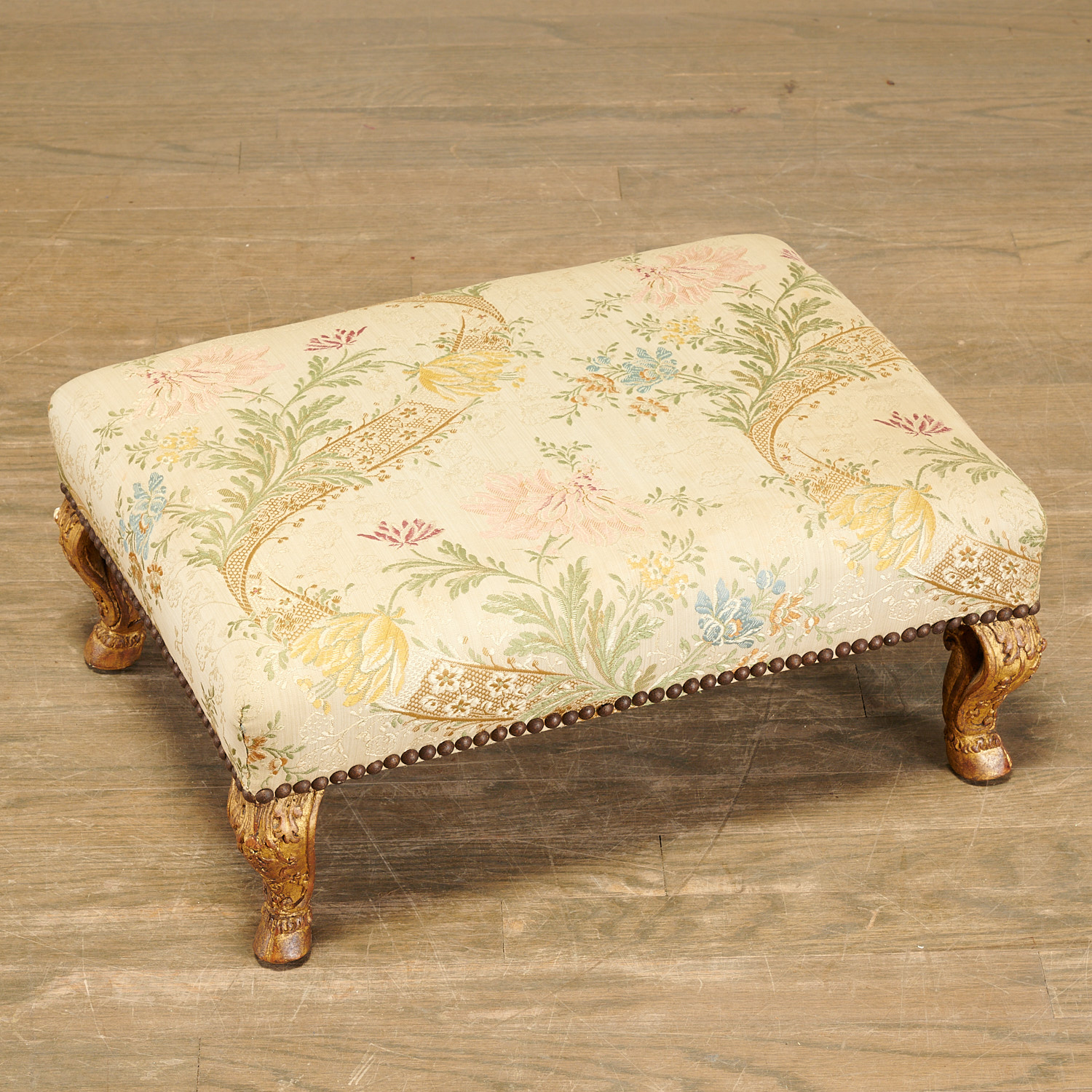 Appraisal: REGENCE CARVED GILTWOOD FOOTSTOOL th c France embroidered silk upholstered