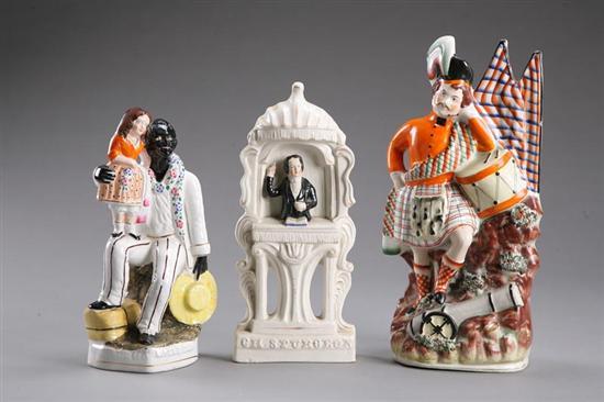 Appraisal: THREE STAFFORDSHIRE FIGURES England mid th century Scotsman with cannon