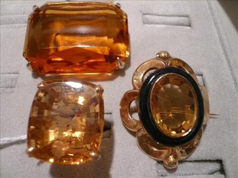 Appraisal: THREE CITRINE ITEMS Ring gold mounting with large citrine engraved