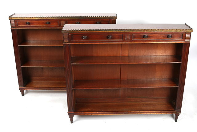 Appraisal: A PAIR OF MAHOGANY PIER CABINETS each with brass galleried