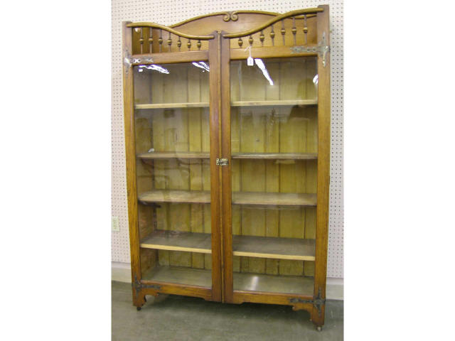 Appraisal: Oak Arts and Crafts bookcase with flat glass doors and