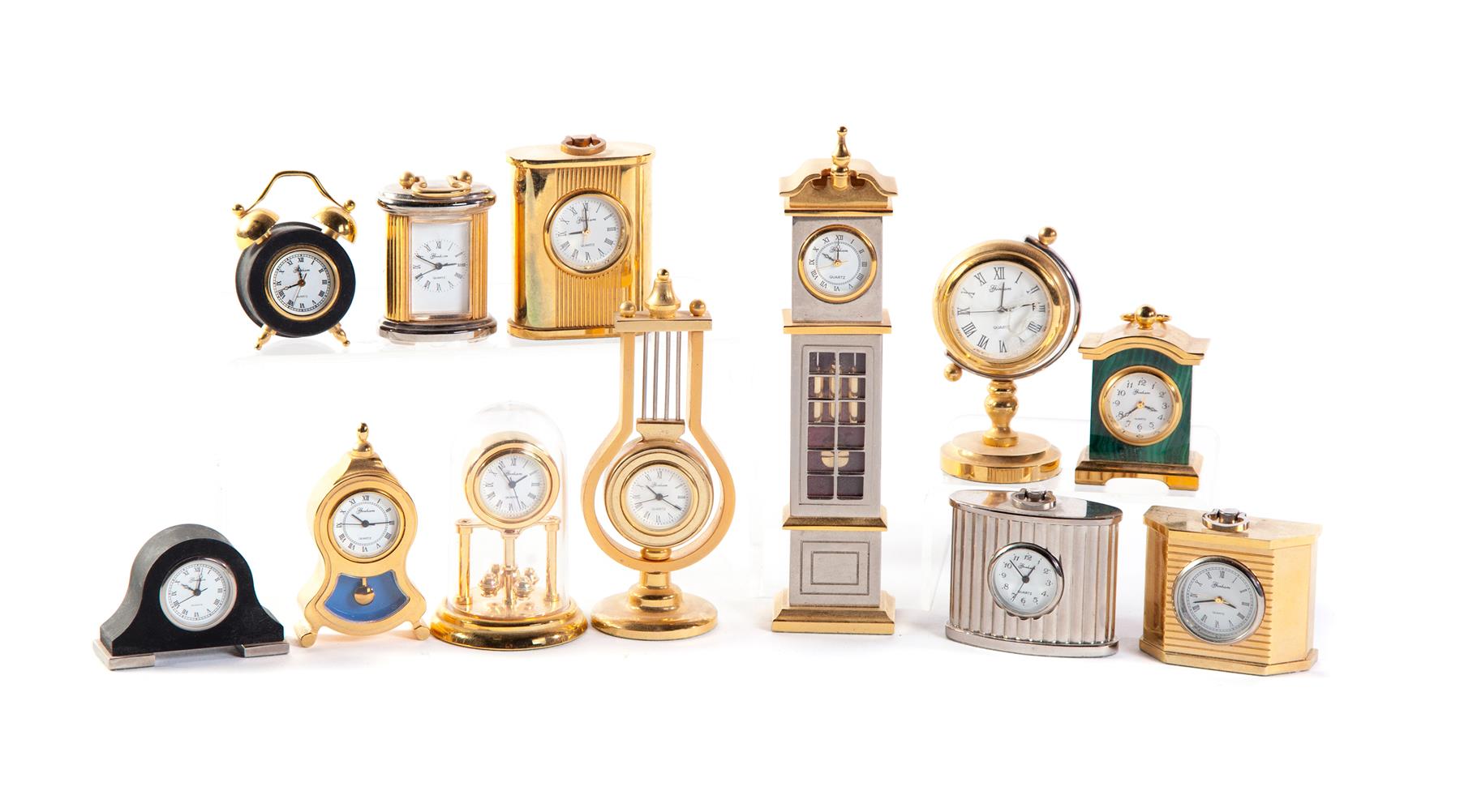 Appraisal: TWELVE MINIATURE CLOCKS AND WOOD DISPLAY CASE Swiss and American