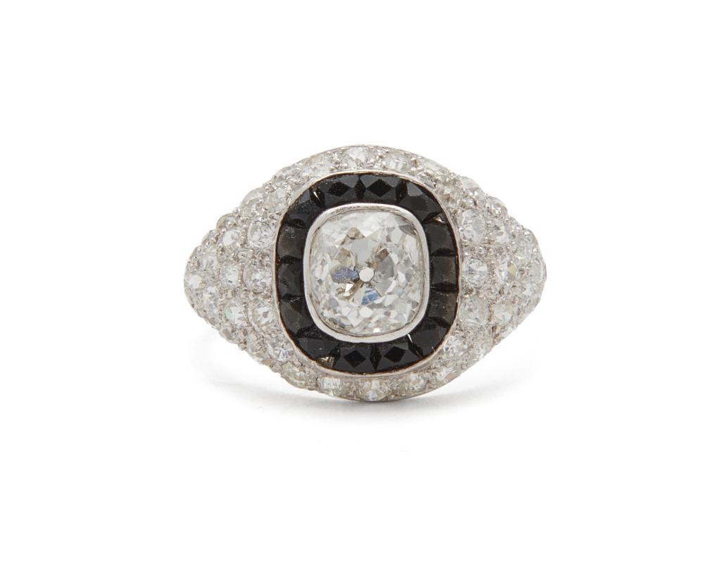 Appraisal: Platinum Diamond and Onyx Ring centering a bezel-set old mine-cut