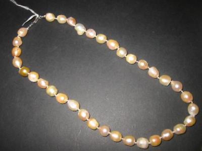 Appraisal: A PINK FRESHWATER PEARL NECKLACE long with silver clasp