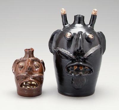 Appraisal: Two E J Brown redware face jugs Evan Javin Brown