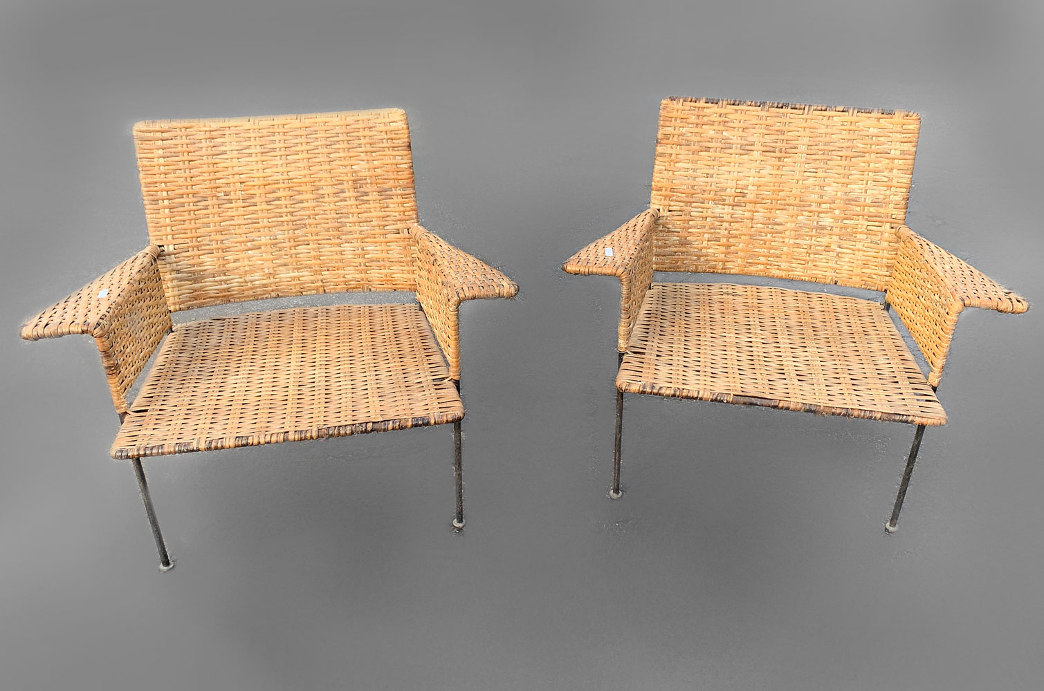 Appraisal: PAIR OF MID-CENTURY WOVEN CLUB CHAIRS Mid-century woven bamboo armchairs