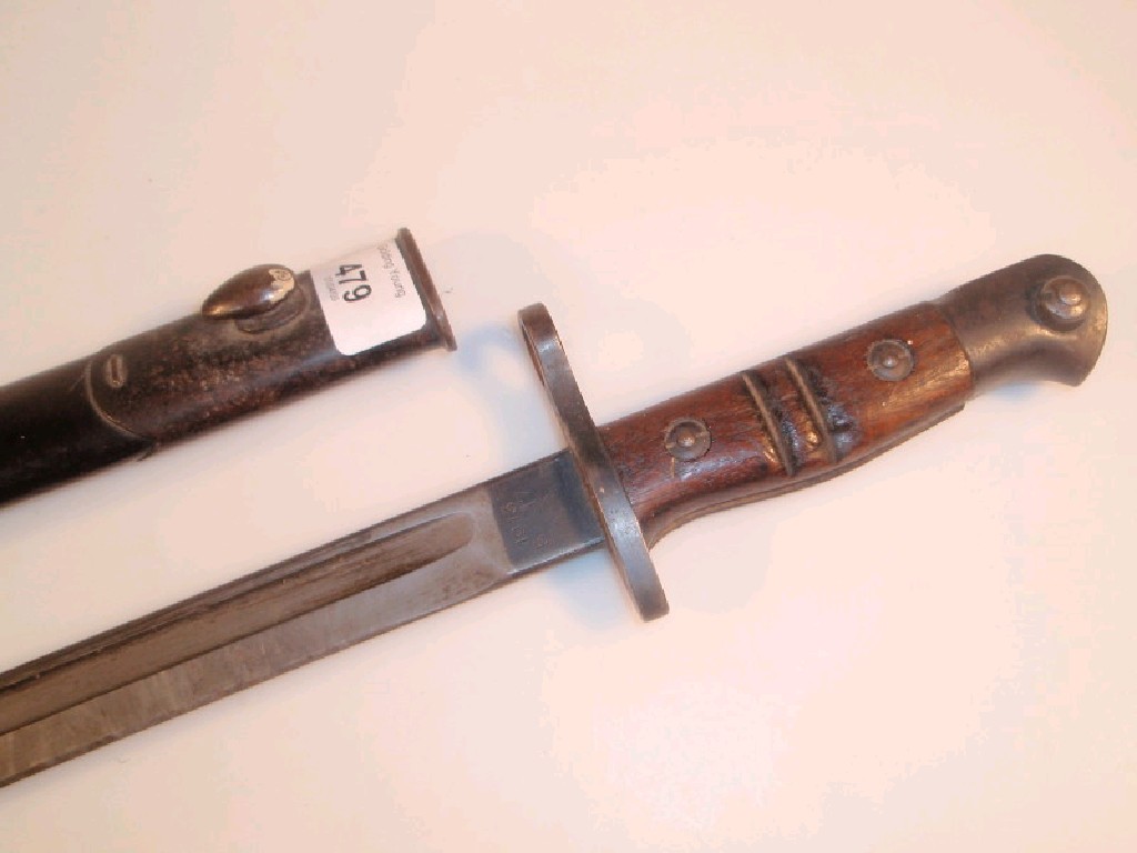 Appraisal: A WWI bayonet with wooden handle marked Remington with a