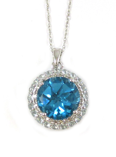 Appraisal: BLUE TOPAZ AND DIAMOND PENDANT NECKLACE suspended on a k