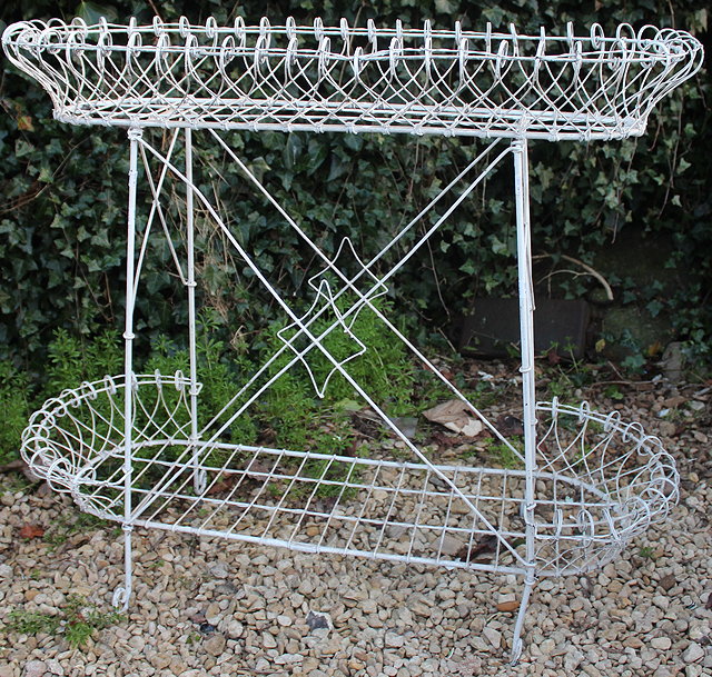 Appraisal: AN EDWARDIAN WHITE PAINTED WIRE WORK CONSERVATORY PLANT STAND with