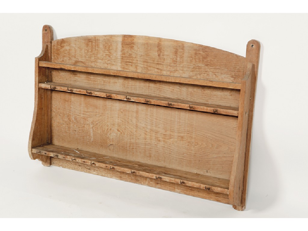 Appraisal: HEALS A LIGHT OAK HANGING PLATE RACK with arched top