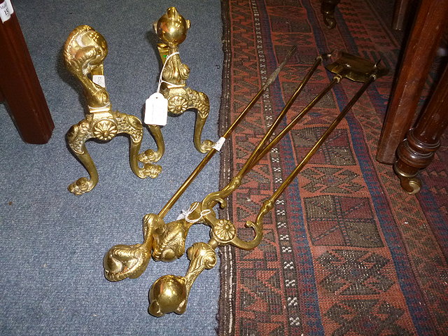 Appraisal: A SET OF THREE BRASS FIRE IRONS with claw and