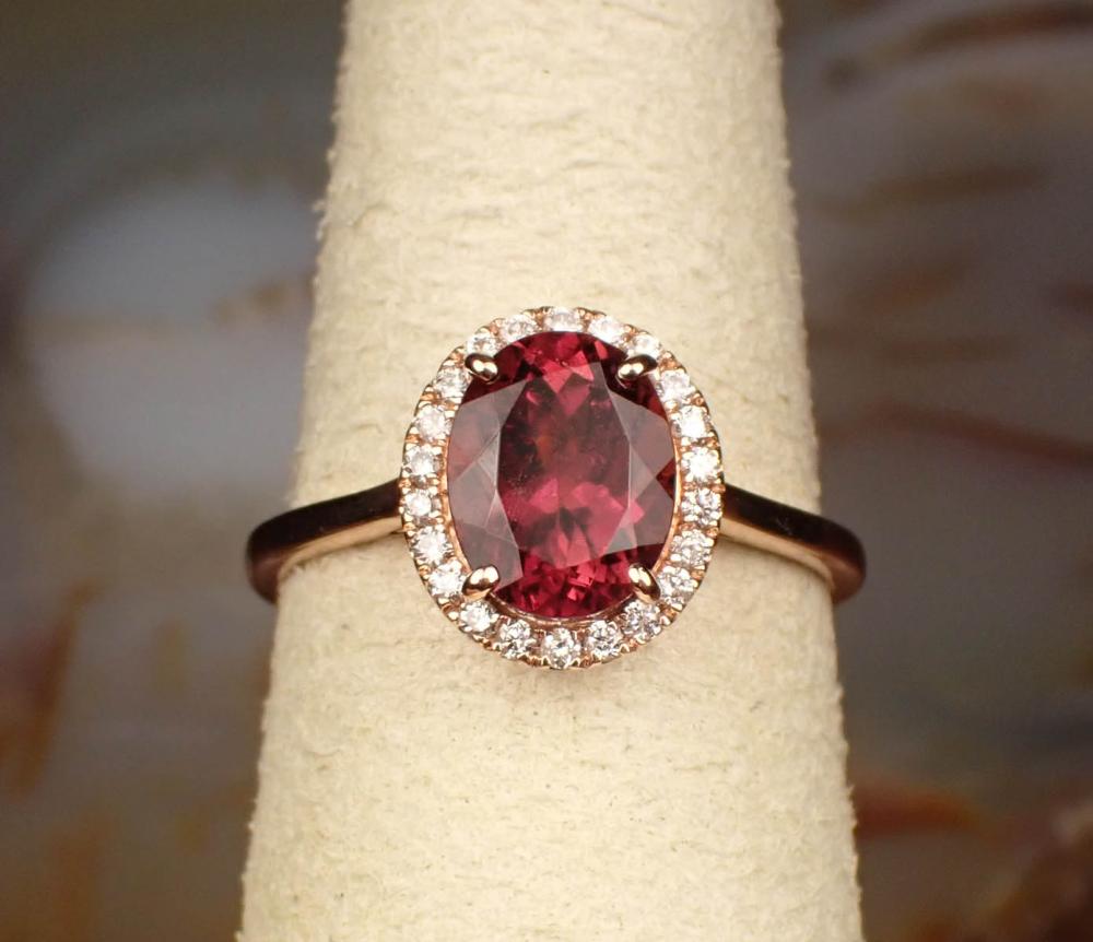 Appraisal: RUBELLITE TOURMALINE AND DIAMOND HALO RING The k rose gold