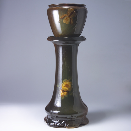 Appraisal: Two Zanesville brown-glazed pieces to include a jardiniere most likely