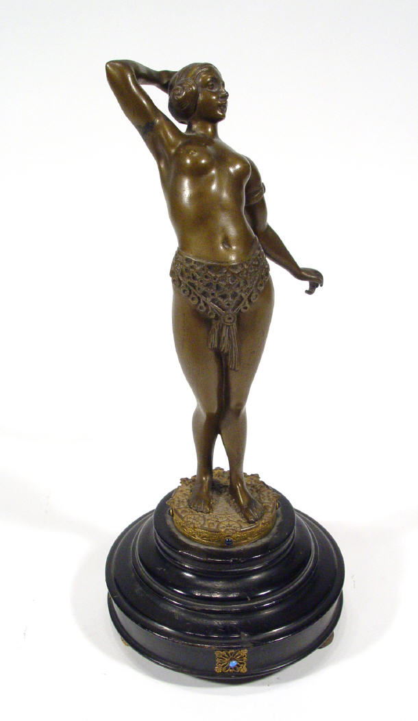 Appraisal: Musical unsigned Art Nouveau bronze reclining scantily clad maiden on