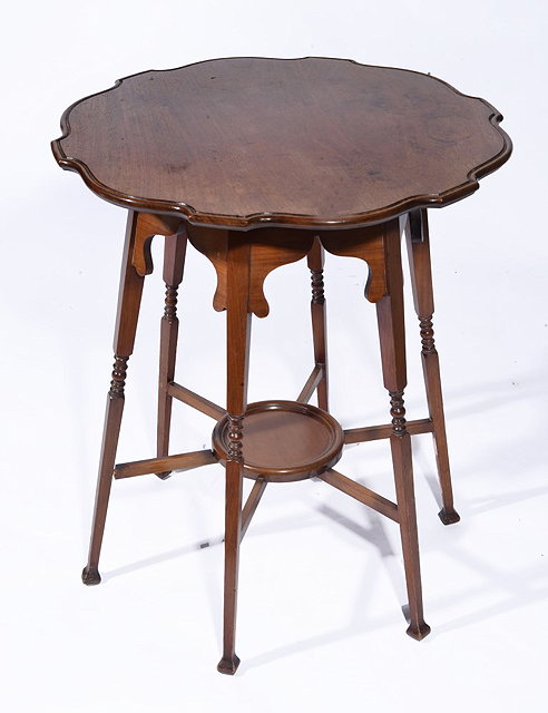 Appraisal: A MORRIS STYLE CENTRE TABLE having a shaped border standing