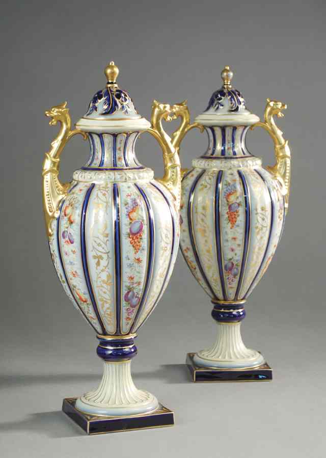 Appraisal: PAIR GERMAN PORCELAIN COVERED URNS in the French taste by