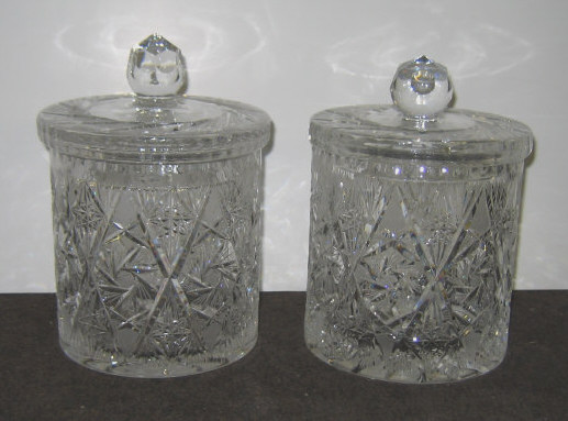 Appraisal: PAIR OF CUT GLASS BISCUIT JARS Each cylindrical with lid