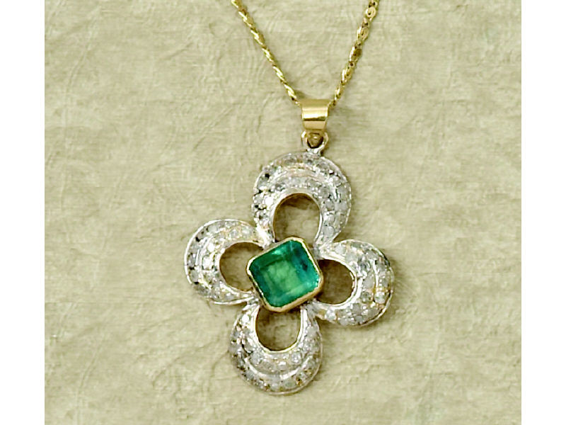 Appraisal: EMERALD AND DIAMOND NECKLACE Yellow gold pendant with white gold